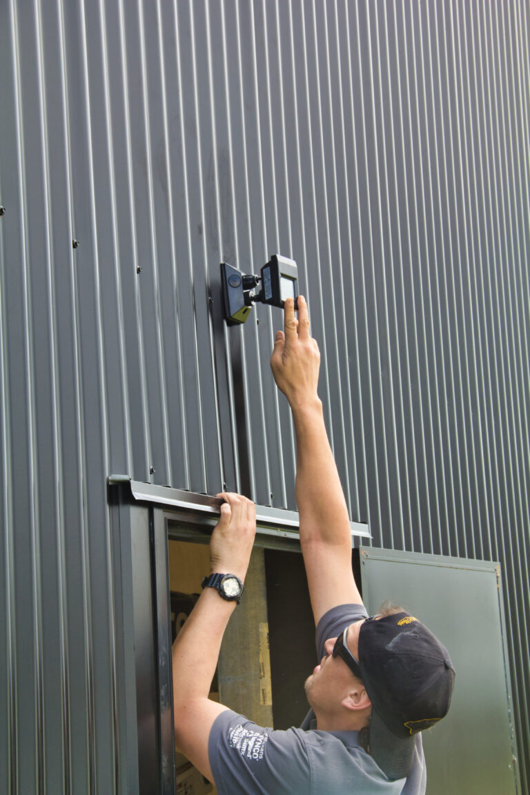 Electrician installing lights